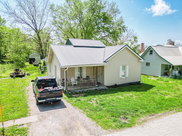 502 Hackberry, Fayette, MO 65248 - single story home featuring a front lawn, covered porch, driveway, and metal roof