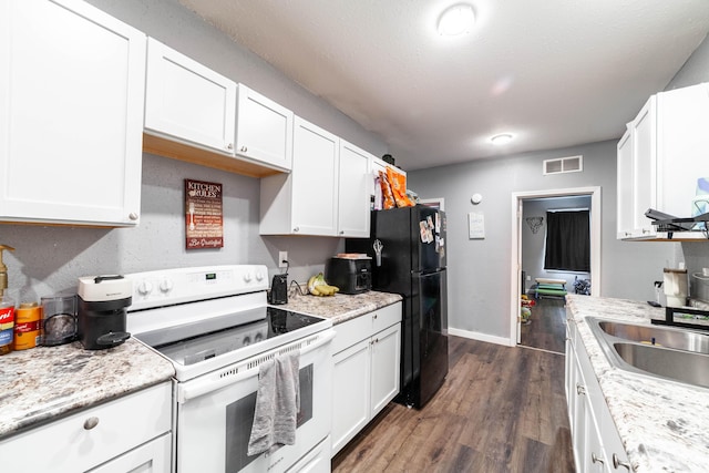 502 Hackberry, Fayette, MO 65248 - kitchen with white cabinets, a sink, white range with electric cooktop, dark wood finished floors, and visible vents