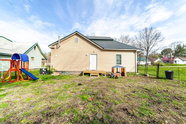 502 Hackberry, Fayette, MO 65248 - rear view of house featuring a lawn, a gate, fence, and metal roof