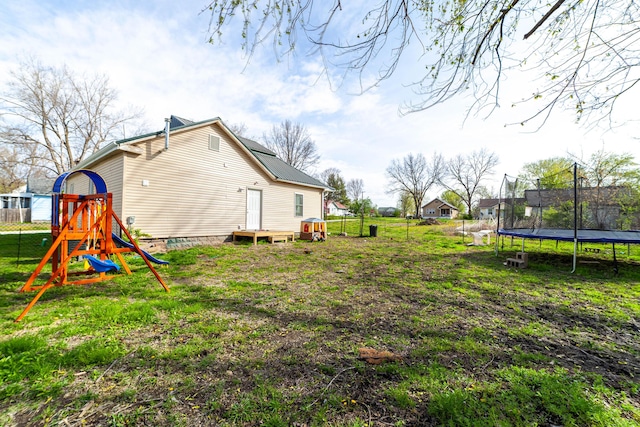 502 Hackberry, Fayette, MO 65248 - view of yard with a playground, fence, and a trampoline