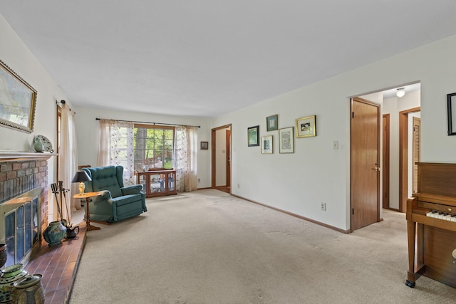 1509 W Rollins Rd, Columbia, MO 65203 - sitting room featuring light colored carpet, baseboards, and a brick fireplace