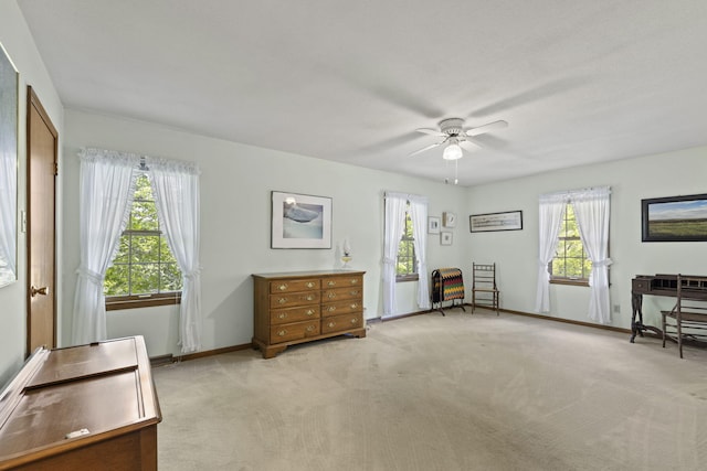 1509 W Rollins Rd, Columbia, MO 65203 - living area with baseboards, ceiling fan, and light colored carpet