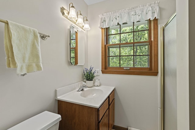 1509 W Rollins Rd, Columbia, MO 65203 - bathroom featuring toilet, vanity, and a stall shower