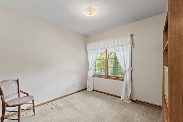 1509 W Rollins Rd, Columbia, MO 65203 - interior space featuring a textured ceiling, carpet flooring, baseboards, and visible vents