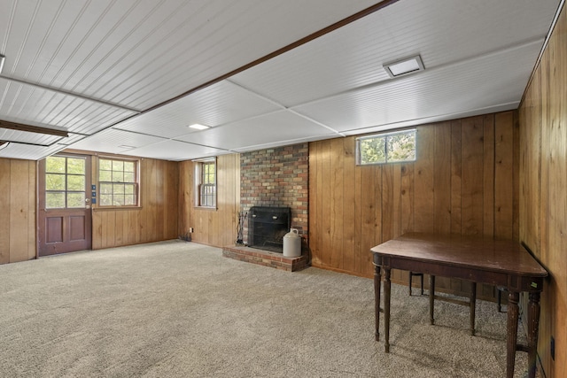 1509 W Rollins Rd, Columbia, MO 65203 - basement with wooden walls, a fireplace, and carpet floors