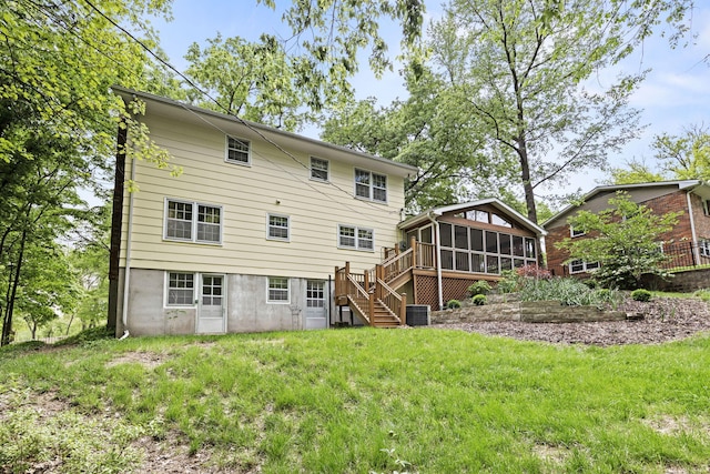 1509 W Rollins Rd, Columbia, MO 65203 - rear view of house featuring a sunroom, stairway, a lawn, and cooling unit