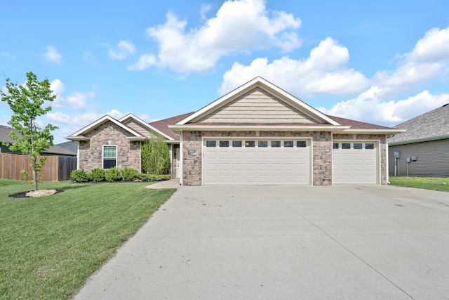 single story home featuring an attached garage, a front lawn, fence, and concrete driveway