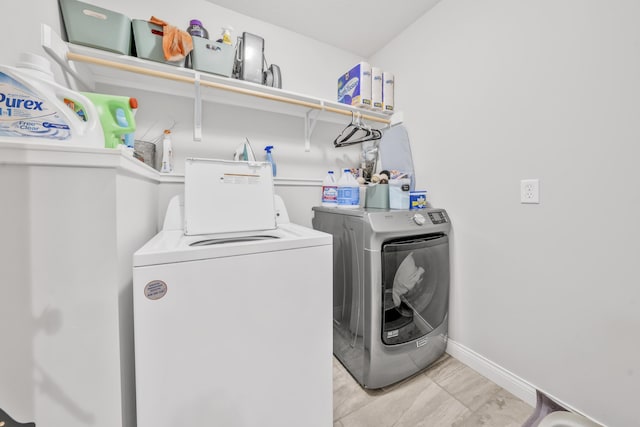 5803 Misty Springs Way, Columbia, MO 65202 - laundry area with laundry area, washer and clothes dryer, and baseboards