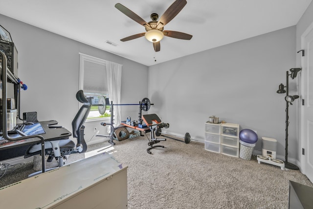 exercise room featuring visible vents, carpet flooring, baseboards, and a ceiling fan