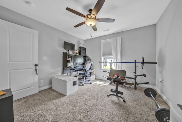 office space with visible vents, a ceiling fan, baseboards, and carpet floors