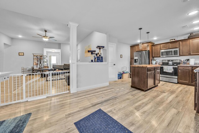 5803 Misty Springs Way, Columbia, MO 65202 - kitchen with a kitchen island, stainless steel appliances, ceiling fan, and light wood finished floors