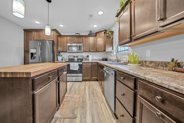 5803 Misty Springs Way, Columbia, MO 65202 - kitchen featuring wooden counters, a sink, light wood-style floors, stainless steel appliances, and recessed lighting