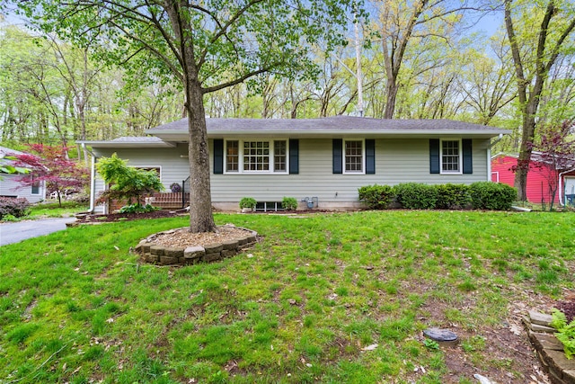 ranch-style home featuring a front yard