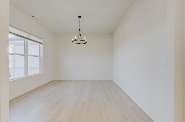 820 Angels Rest Way, Columbia, MO 65203 - unfurnished room with baseboards, wood finished floors, a chandelier, and visible vents