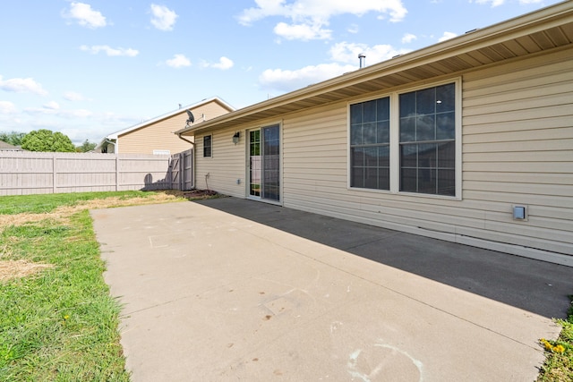 view of patio featuring fence