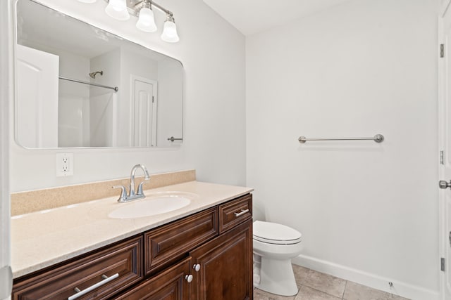 full bathroom featuring vanity, tile patterned flooring, baseboards, and toilet