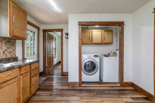 5435 N Creasy Springs Rd, Columbia, MO 65202 - clothes washing area with separate washer and dryer, dark wood finished floors, cabinet space, and baseboards