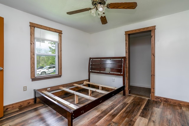5435 N Creasy Springs Rd, Columbia, MO 65202 - bedroom featuring baseboards, ceiling fan, and wood finished floors
