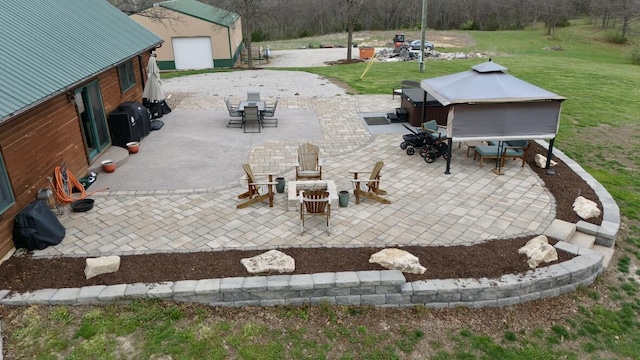 view of patio featuring outdoor dining area and an outdoor structure