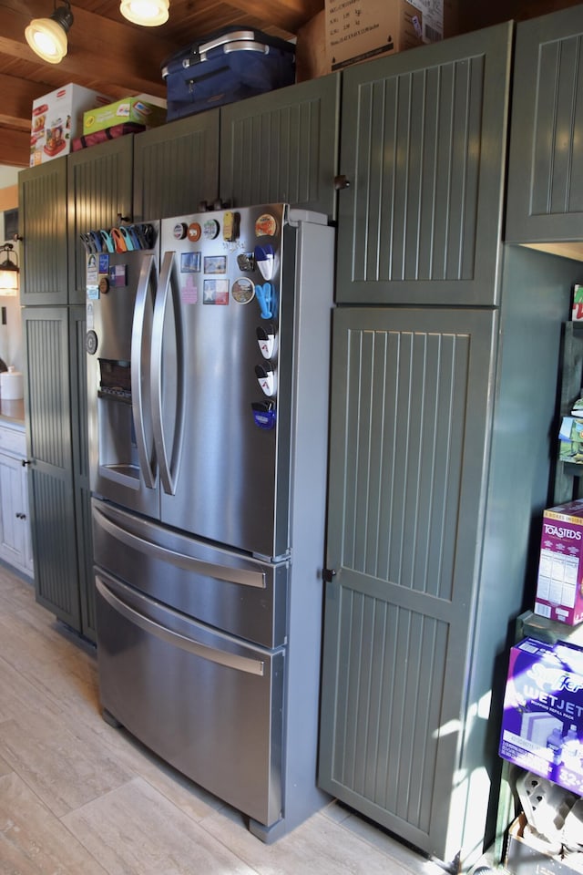 kitchen with stainless steel fridge and light wood-type flooring