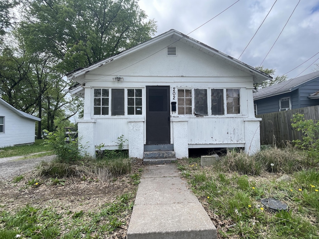 bungalow with fence and entry steps
