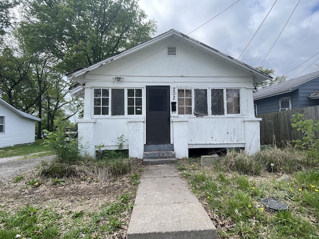 bungalow with fence and entry steps