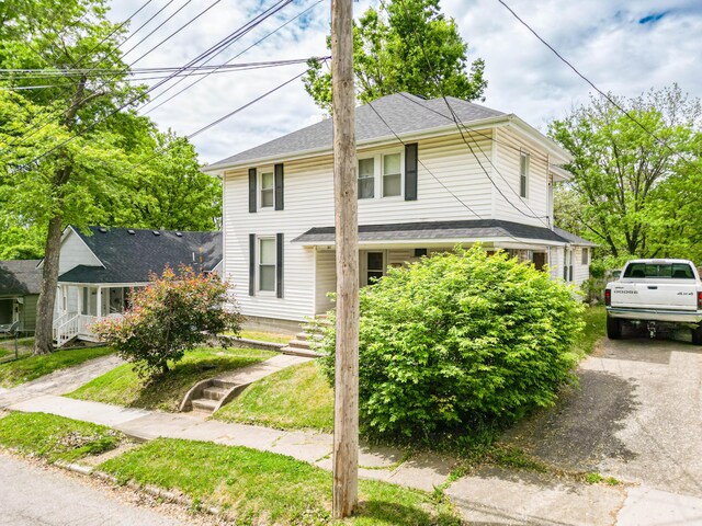 207 Lucky St, Fayette, MO 65248 - view of front of property with driveway and roof with shingles