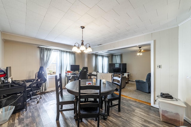 207 Lucky St, Fayette, MO 65248 - dining area featuring wood finished floors, ceiling fan with notable chandelier, crown molding, visible vents, and baseboards