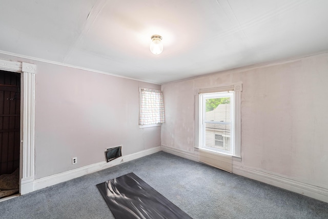207 Lucky St, Fayette, MO 65248 - carpeted empty room featuring crown molding, baseboards, and visible vents