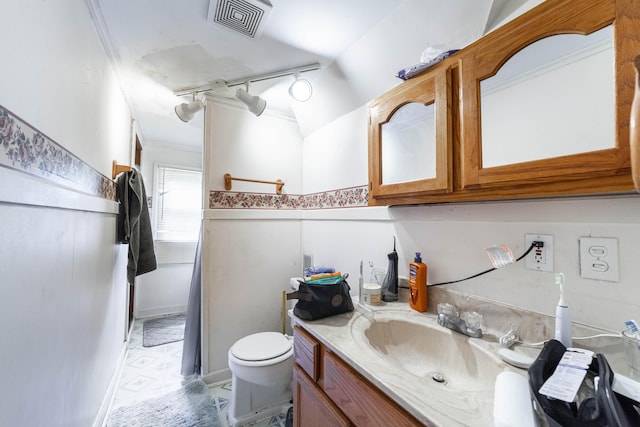 207 Lucky St, Fayette, MO 65248 - bathroom featuring toilet, track lighting, crown molding, visible vents, and vanity