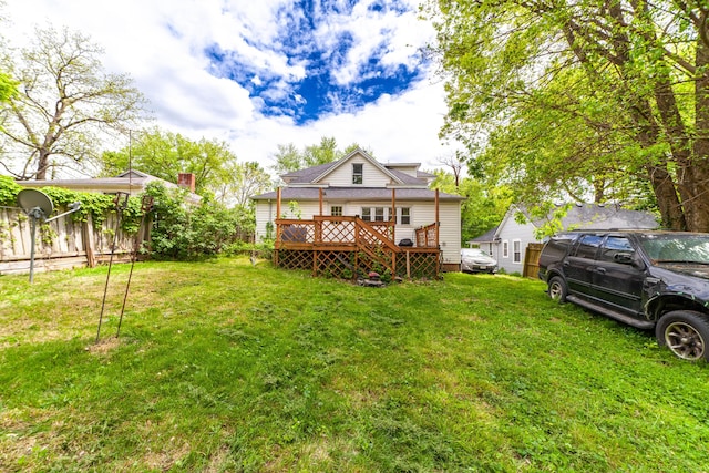 207 Lucky St, Fayette, MO 65248 - back of property with a lawn, a deck, and fence
