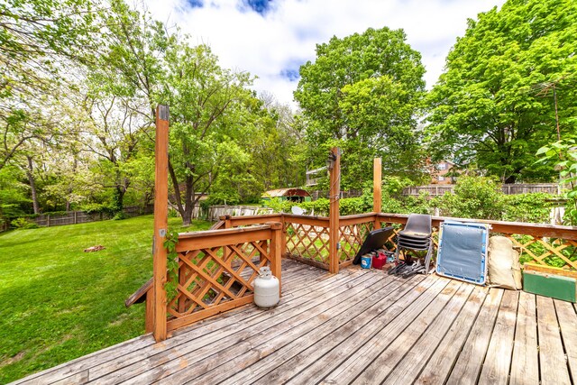 207 Lucky St, Fayette, MO 65248 - wooden deck featuring a lawn and a fenced backyard
