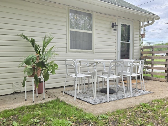 view of patio / terrace featuring fence and outdoor dining space