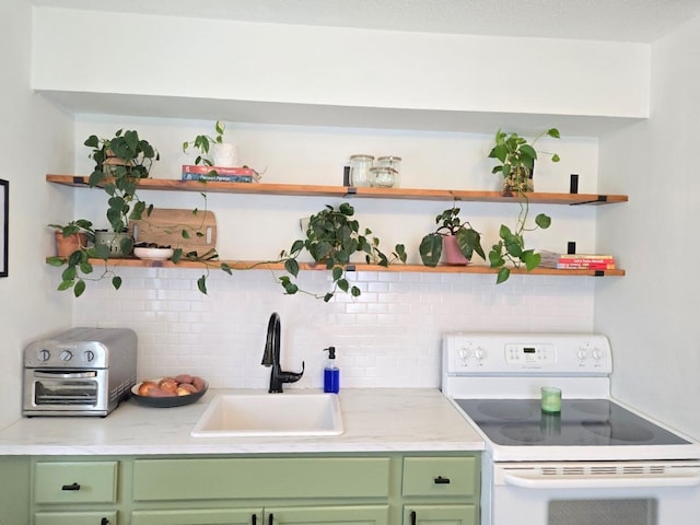 bar featuring a sink, backsplash, and electric stove