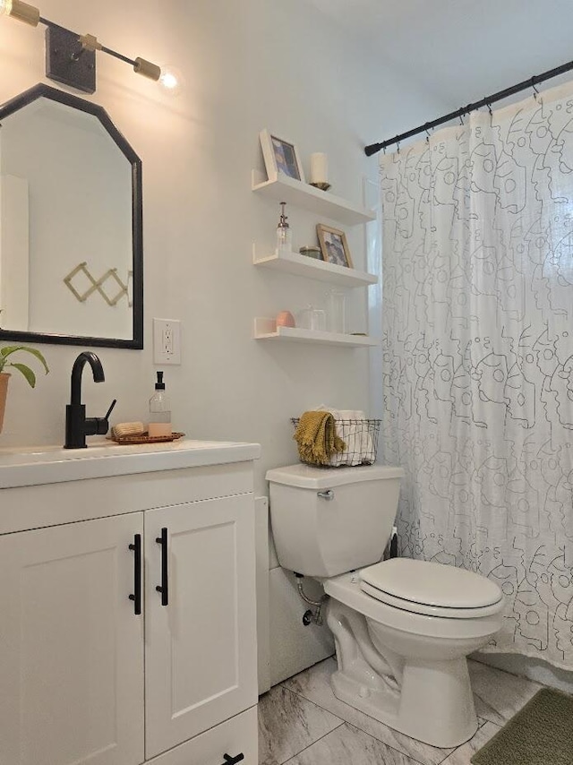 bathroom featuring vanity, marble finish floor, toilet, and a shower with curtain