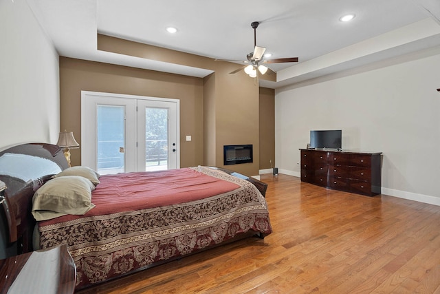 4520 County Road 1245, Moberly, MO 65270 - bedroom featuring baseboards, access to exterior, and wood finished floors