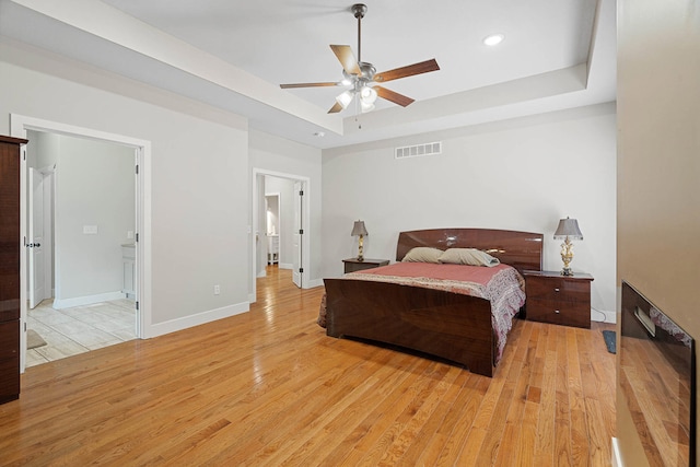 4520 County Road 1245, Moberly, MO 65270 - bedroom featuring visible vents, baseboards, recessed lighting, a raised ceiling, and light wood finished floors