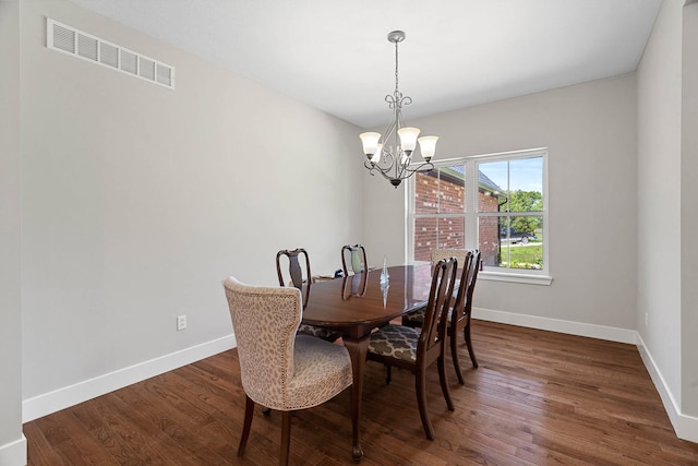 4520 County Road 1245, Moberly, MO 65270 - dining area with an inviting chandelier, baseboards, dark wood-style floors, and visible vents