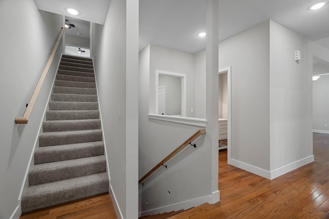 4520 County Road 1245, Moberly, MO 65270 - stairway featuring baseboards, recessed lighting, and wood finished floors