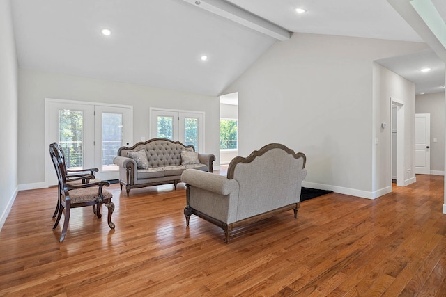 4520 County Road 1245, Moberly, MO 65270 - living room featuring baseboards, beamed ceiling, light wood finished floors, and high vaulted ceiling