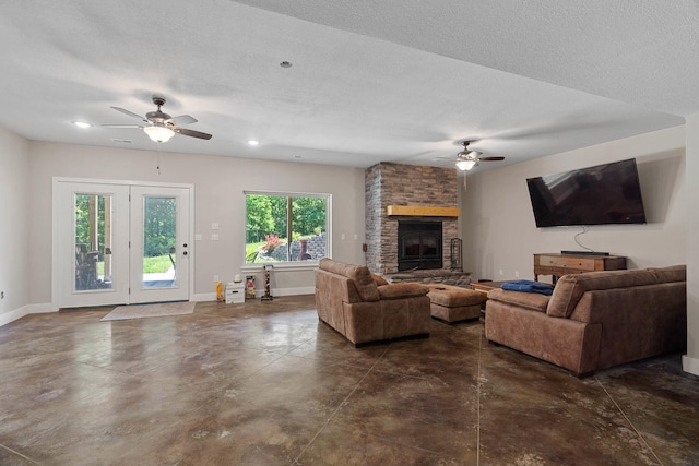 4520 County Road 1245, Moberly, MO 65270 - living room with a ceiling fan, finished concrete floors, a fireplace, baseboards, and recessed lighting