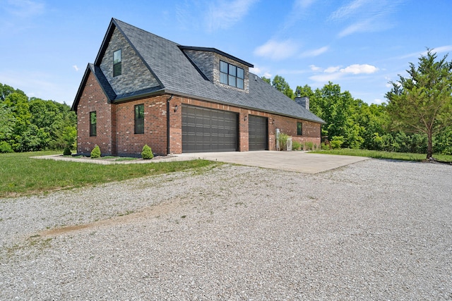 4520 County Road 1245, Moberly, MO 65270 - view of front facade with concrete driveway, brick siding, an attached garage, and a shingled roof