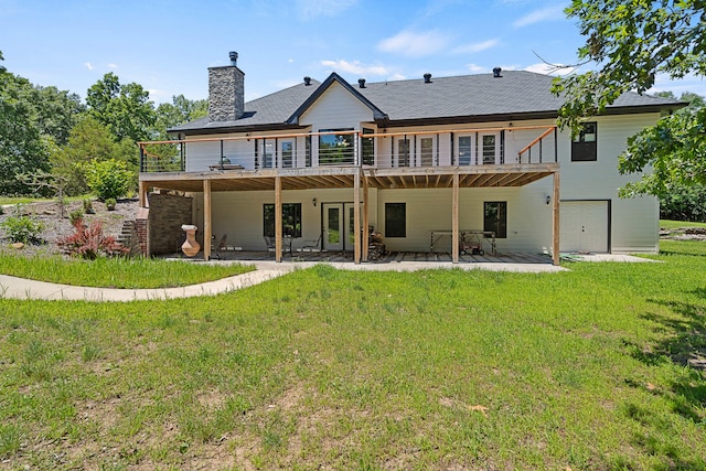 4520 County Road 1245, Moberly, MO 65270 - rear view of property featuring a patio, a lawn, a chimney, and a deck