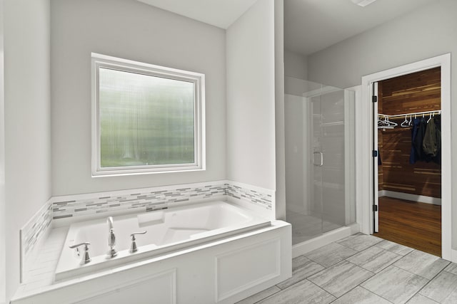 4520 County Road 1245, Moberly, MO 65270 - full bathroom with a garden tub, a spacious closet, and a shower stall