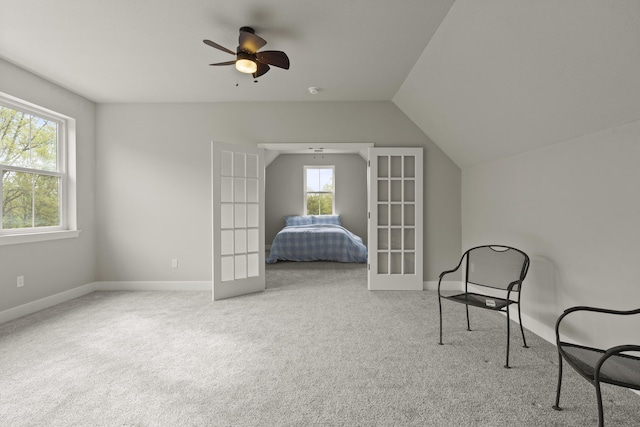 4520 County Road 1245, Moberly, MO 65270 - unfurnished bedroom featuring carpet flooring, baseboards, french doors, and lofted ceiling