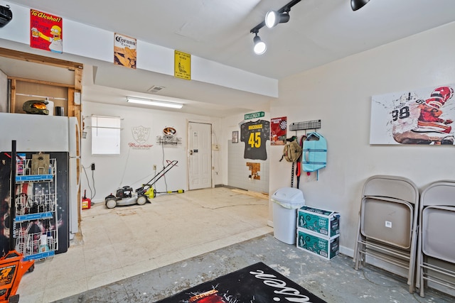 garage with freestanding refrigerator