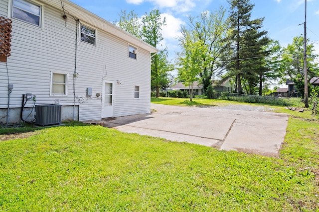back of property featuring central AC and a patio area