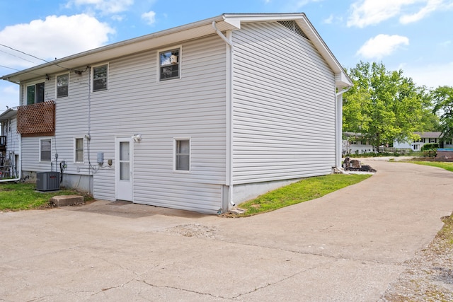 view of side of home featuring central air condition unit