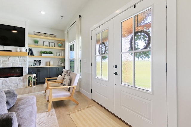 7495 N Rte Z, Columbia, MO 65202 - doorway to outside with light wood-style floors, french doors, baseboards, and a stone fireplace