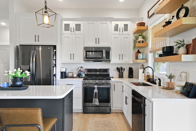 7495 N Rte Z, Columbia, MO 65202 - kitchen featuring open shelves, light countertops, white cabinetry, and stainless steel appliances
